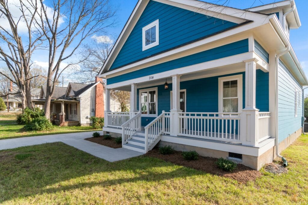 Blue craftsman home with a white porch and side steps - ENERGY STAR certification in Chelsea, MA