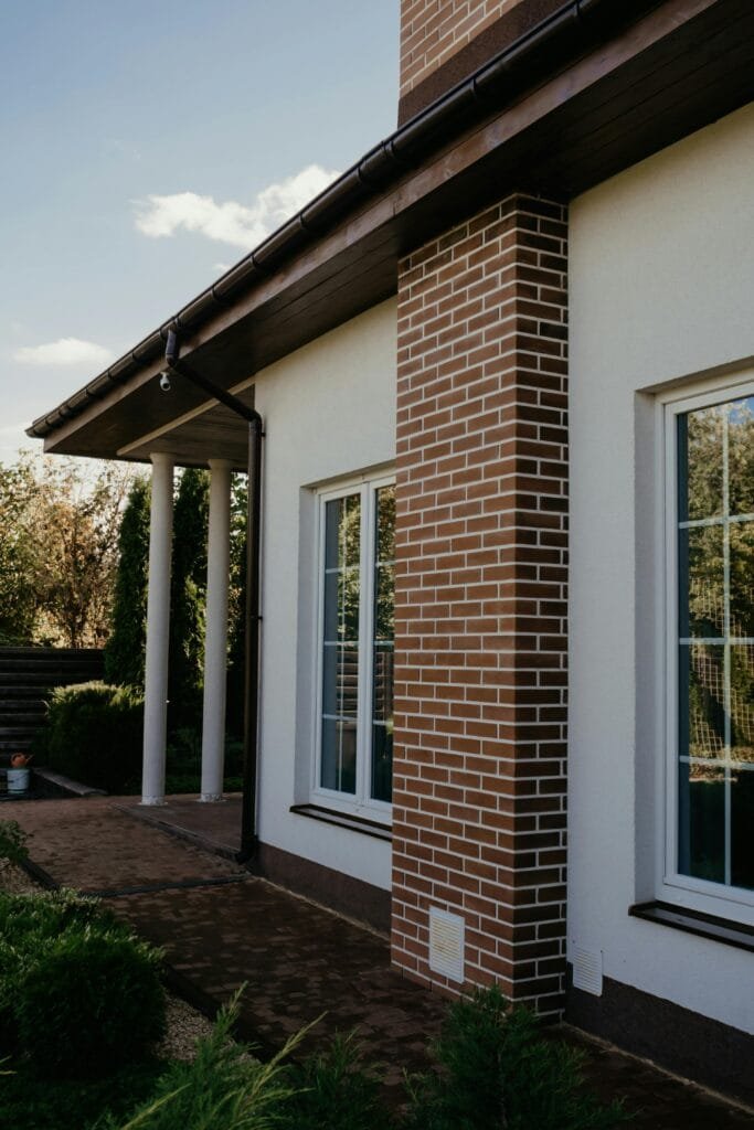 Brick and white stucco entry detail with tall windows - ENERGY STAR certification in Cambridge, MA