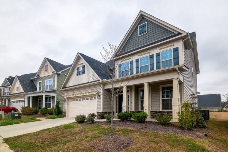 New two-story home with multiple gables and a front porch - HERS rating in Avon, MA