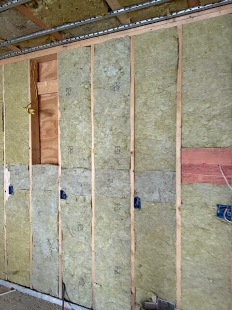 Mineral wool batts fitted between studs with taped seams - HERS rating in Hancock, MA