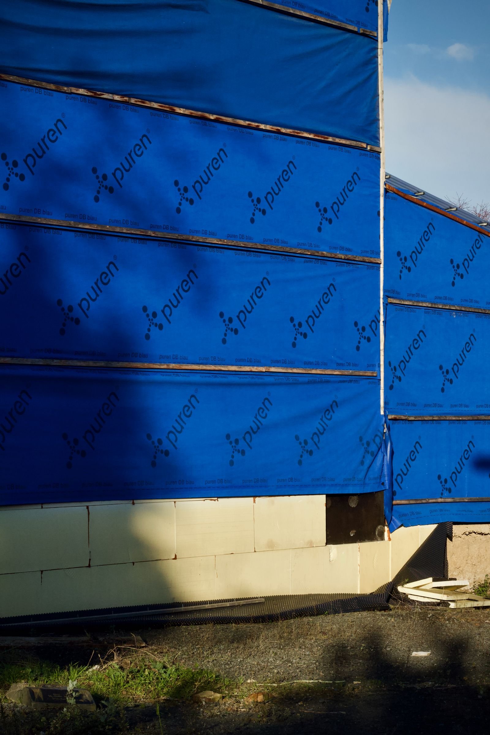 Blue air and weather barrier membrane installed on a new building - Phius Passive House verification in Massachusetts