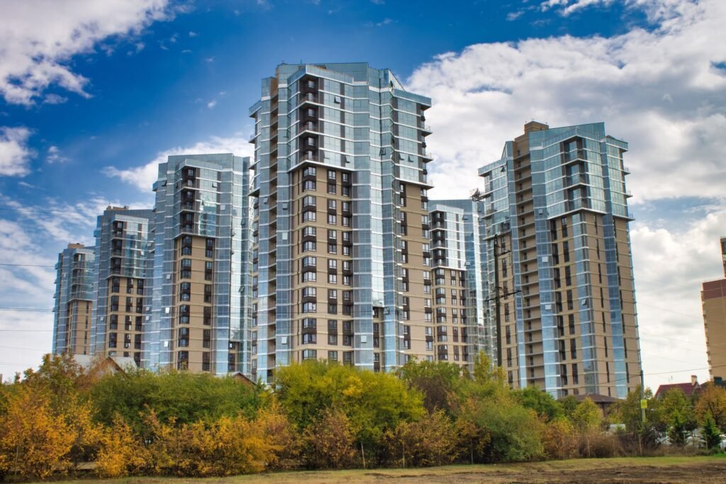 Cluster of new high-rise apartment towers above autumn trees - HERS rating in Boxford, MA