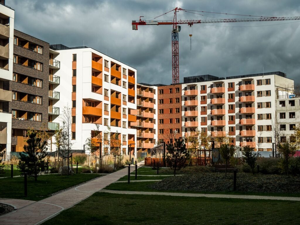 Mid-rise apartment complex under construction with a tower crane - HERS rating in Buckland, MA