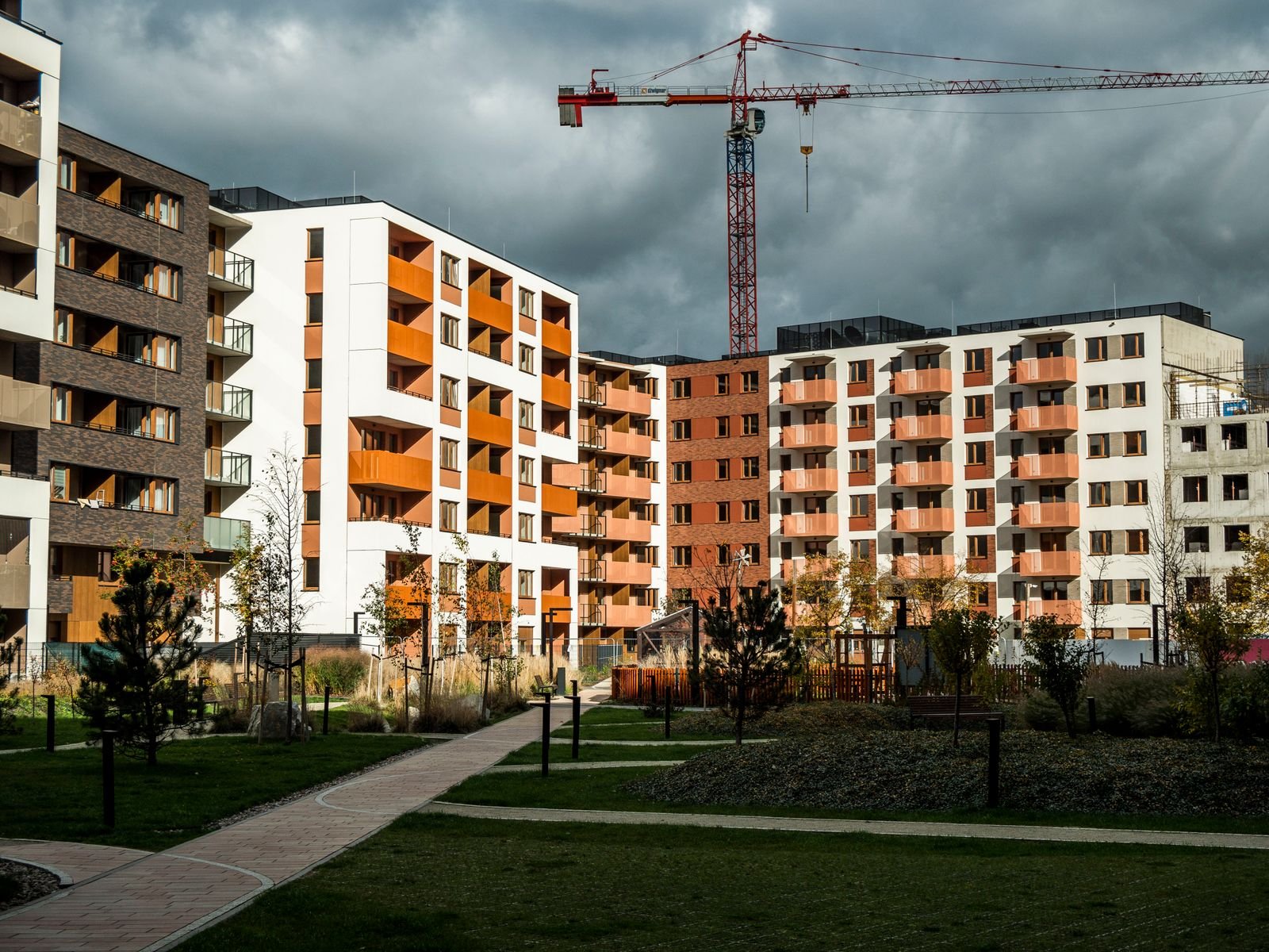 New multifamily apartment complex with construction crane - Phius Passive House verification in Boston, MA
