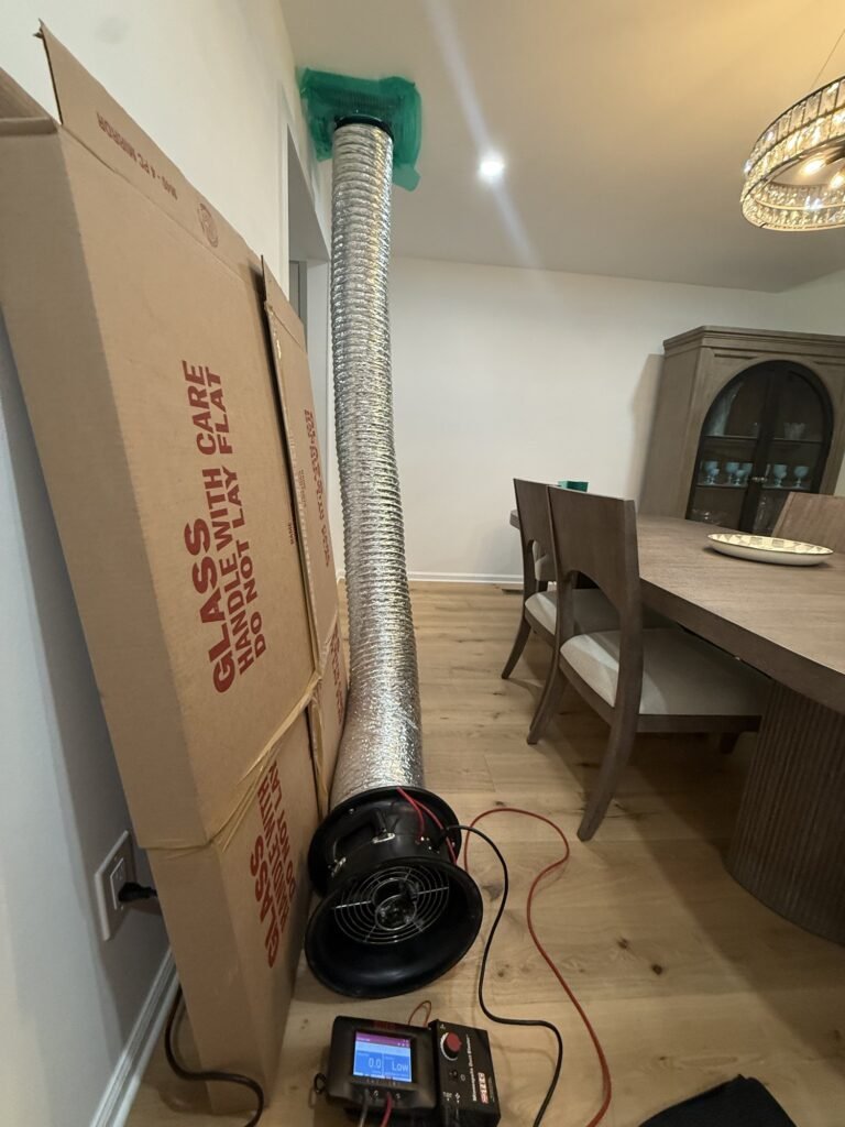 Flex duct running from a ceiling register to a duct test fan in a dining room - HERS rating in Ludlow, MA