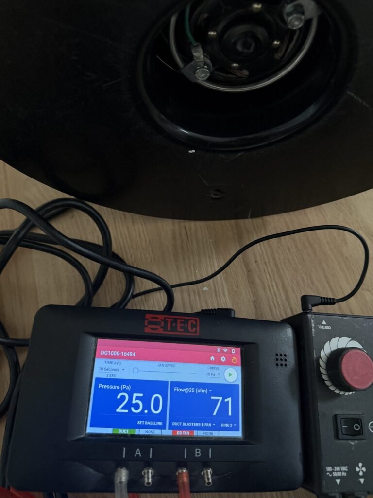 Duct Blaster gauge at 25 Pa test pressure reading 71 CFM25 of total duct leakage during a total leakage test – HEEC duct leakage testing for Montague, MA homes
