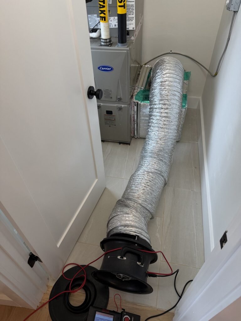 Duct Blaster connected straight to the furnace cabinet in a utility closet - duct leakage testing in Boston, MA