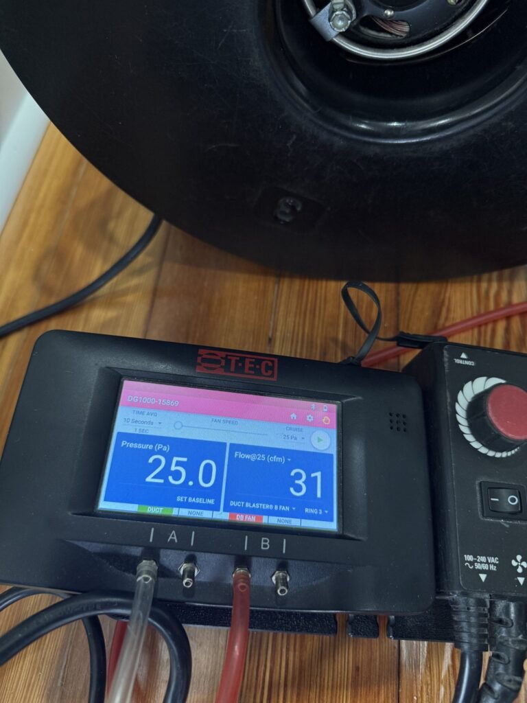 Duct Blaster gauge at 25 Pa test pressure reading 31 CFM25 of total duct leakage close up – HEEC duct leakage testing for Savoy, MA homes