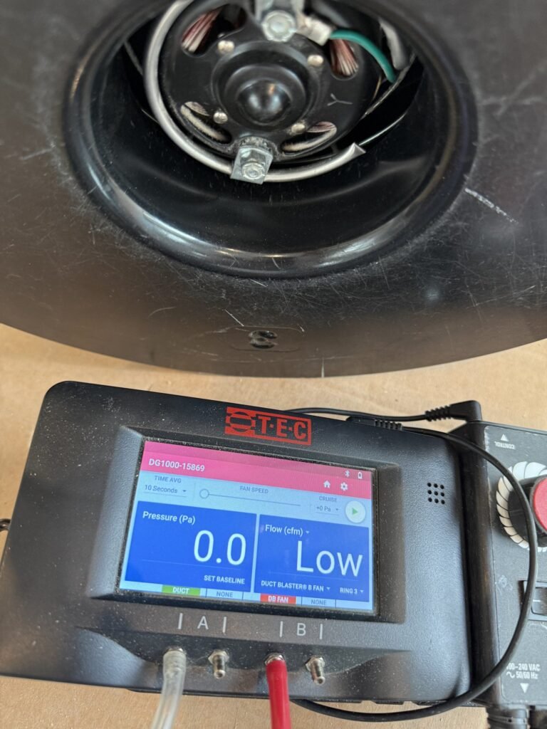 Manometer zeroed at 0.0 Pa with a Low flow reading before the fan starts - duct leakage testing in Wellesley, MA