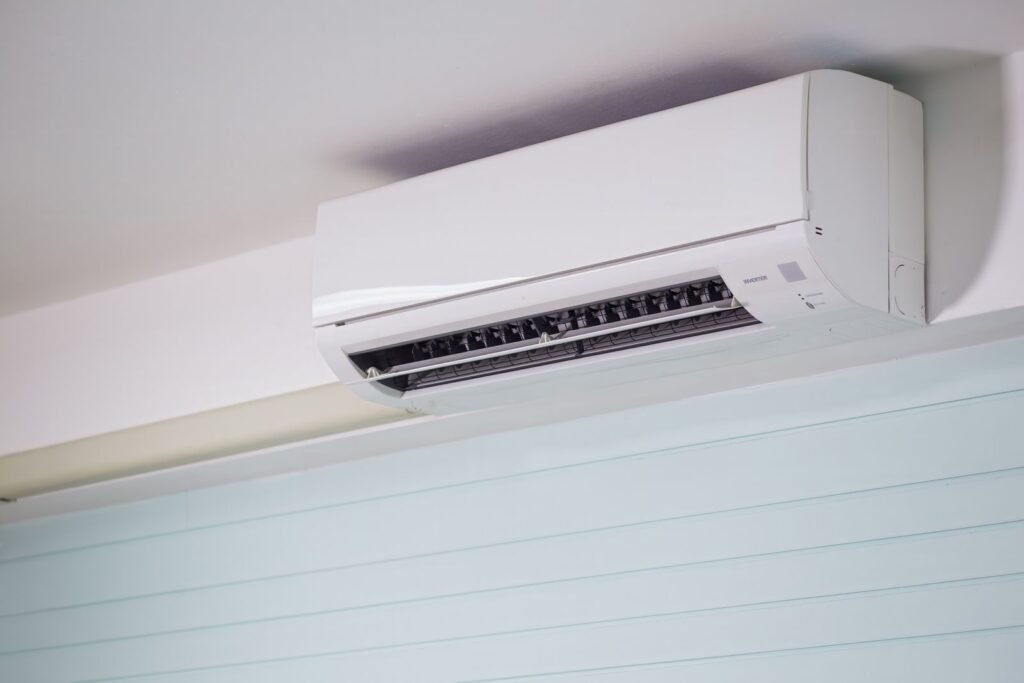 Ductless mini-split indoor unit mounted high on a white wall - HERS rating in Dalton, MA