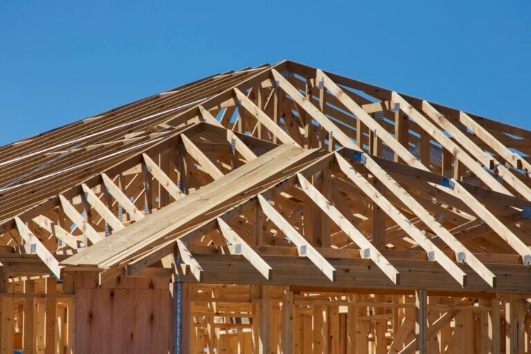 New home with roof trusses set on the wall framing - stretch code report for a building permit in Wellesley, MA