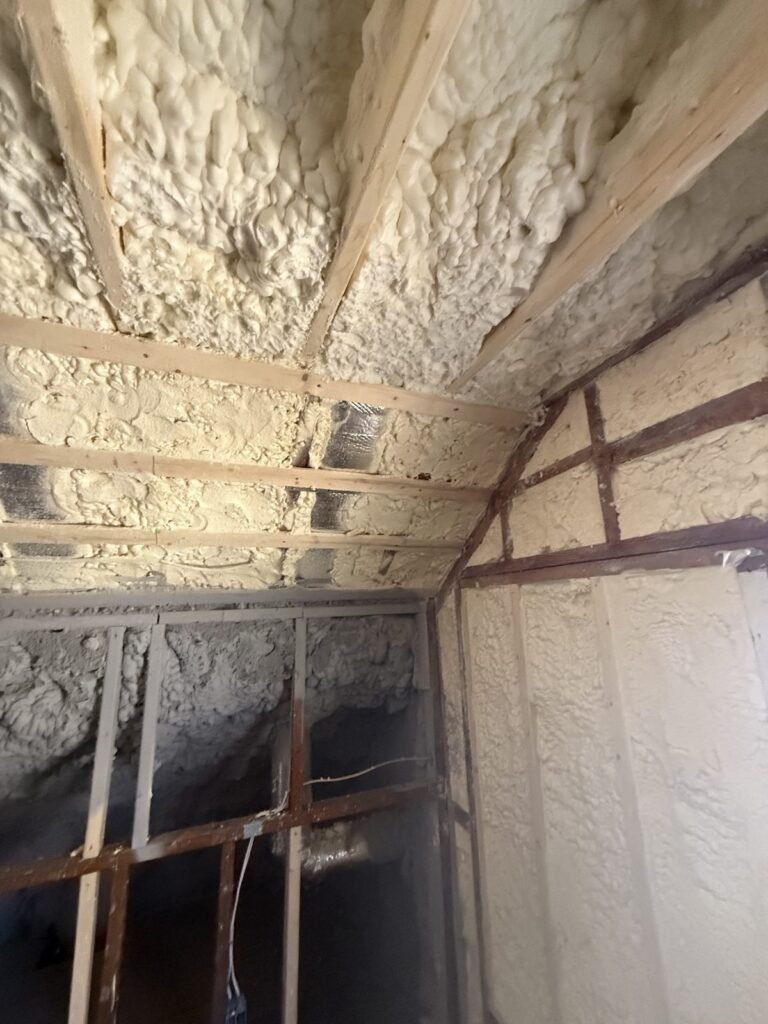 Spray foam sealing a sloped attic ceiling and kneewall in an older home - spray foam insulation in Bourne, MA