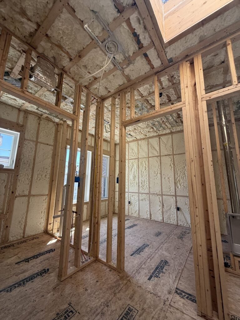 Interior partition framing in a room with foamed exterior walls and a skylight - HERS rating in Douglas, MA