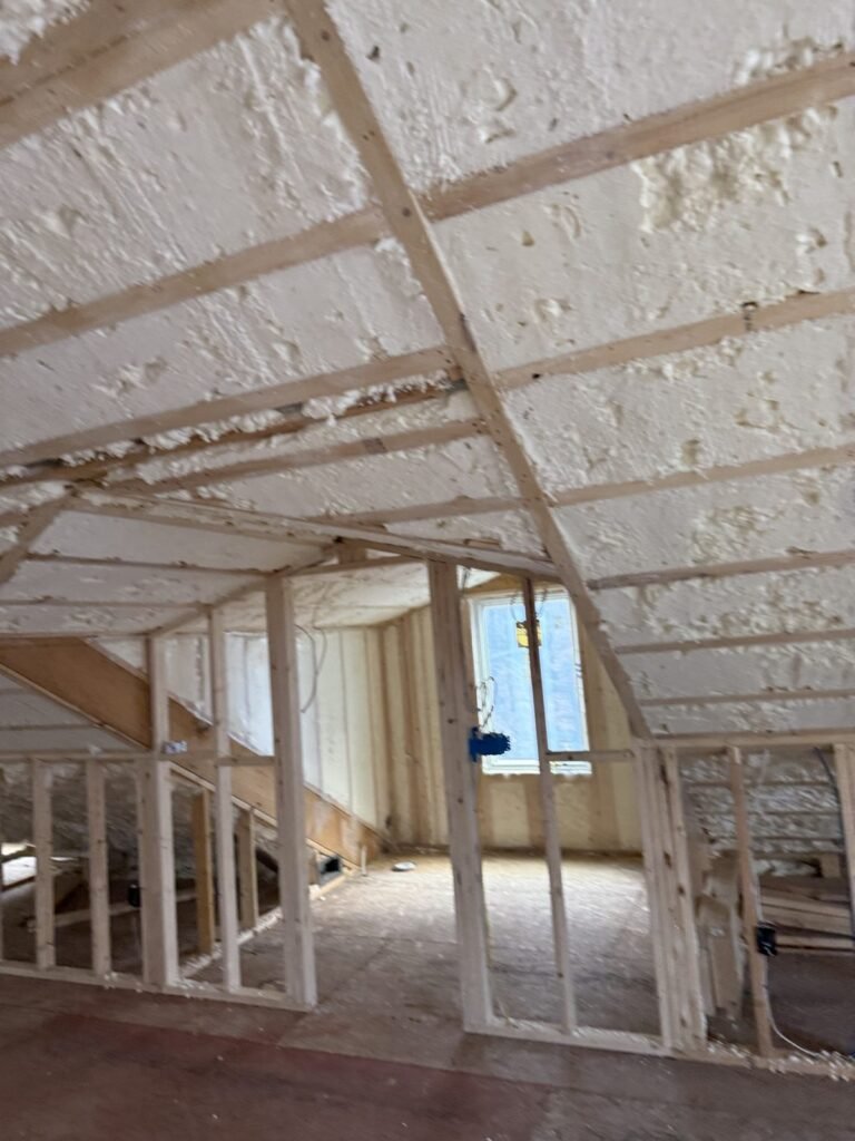 Spray foam on the roof slope above new attic kneewalls - spray foam insulation in Acton, MA
