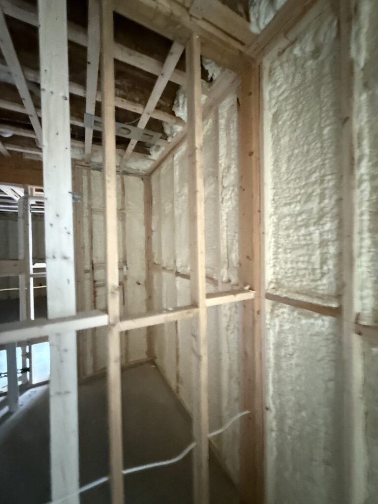 Spray foam on exterior walls behind new basement framing - spray foam insulation in Southampton, MA