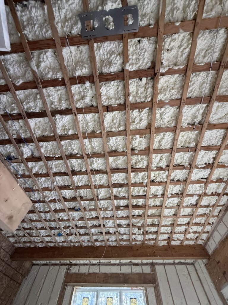 Foamed ceiling behind a grid of wood strapping - HERS rating in Carlisle, MA