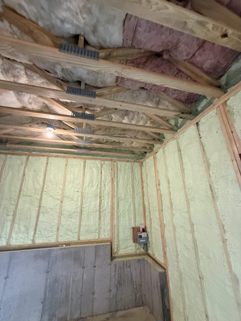 Spray-foamed basement room around an electrical panel - spray foam insulation in Everett, MA