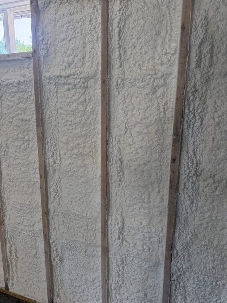 Spray foam filling exterior wall bays from floor to ceiling - spray foam insulation in Shirley, MA