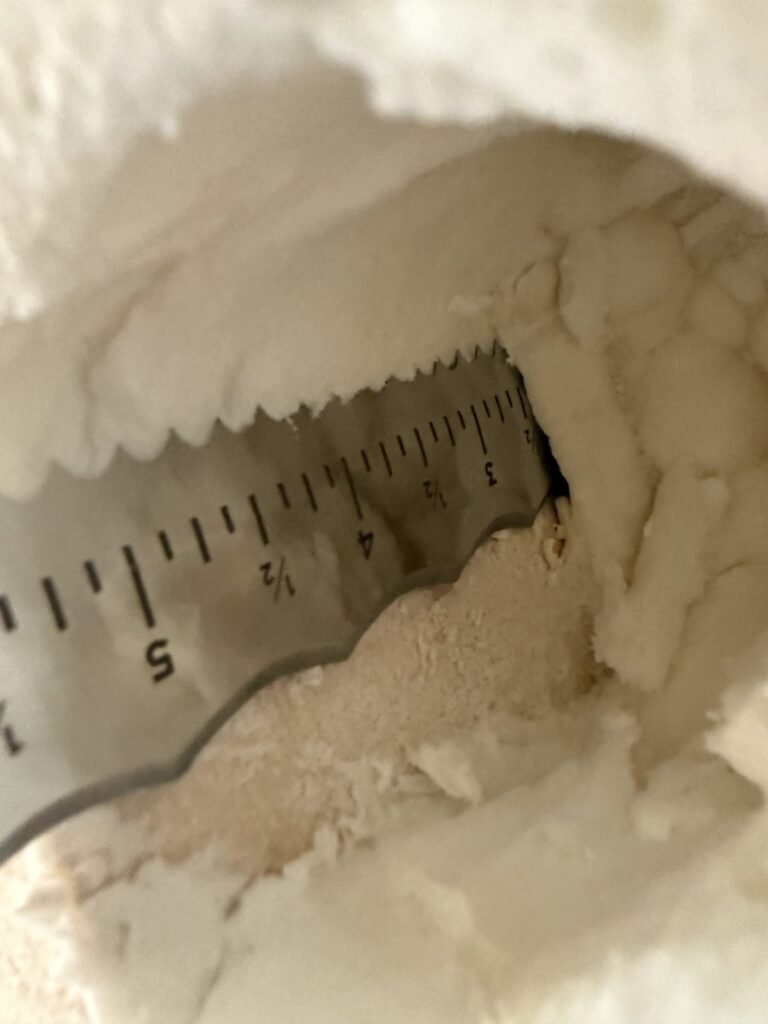 Ruler measuring the depth of a spray foam layer - spray foam insulation in Hancock, MA