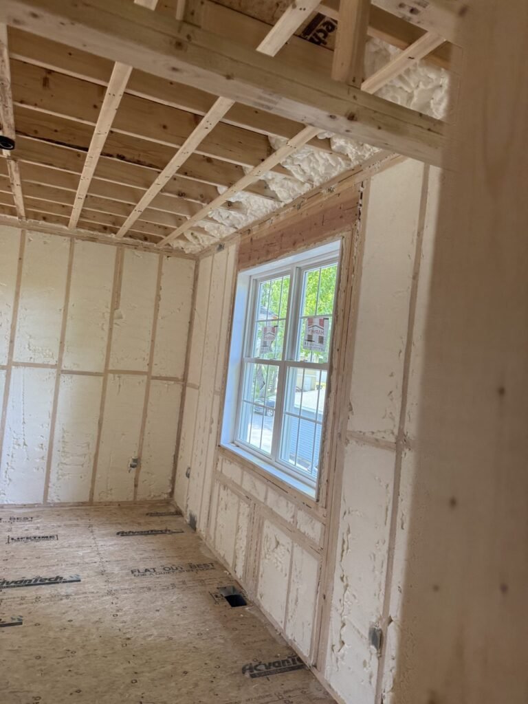Spray foam insulated walls around a double-hung window - HERS rating in Hadley, MA