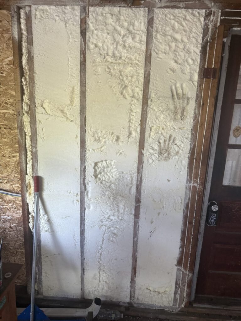Foamed wall bays beside an interior door opening - HERS rating in Dracut, MA