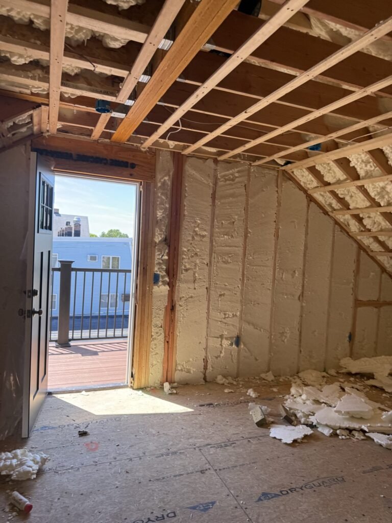 Spray foam around a balcony door in a top-floor room - spray foam insulation in Chicopee, MA