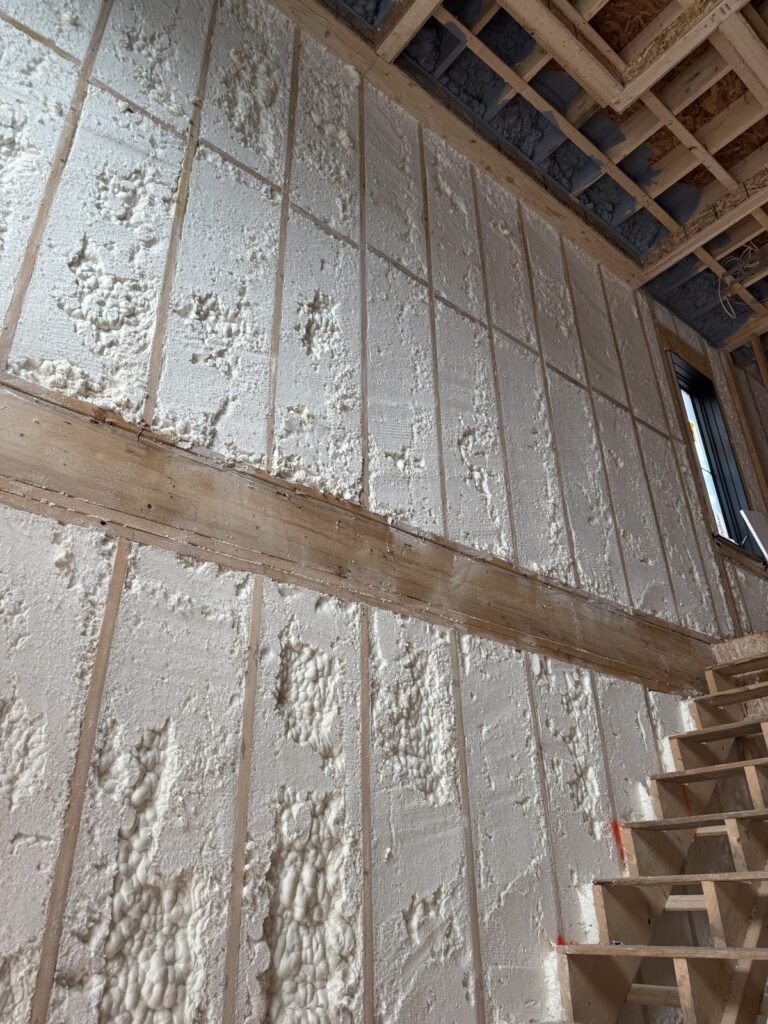 Spray foam on a tall stairwell wall - spray foam insulation in Easthampton, MA