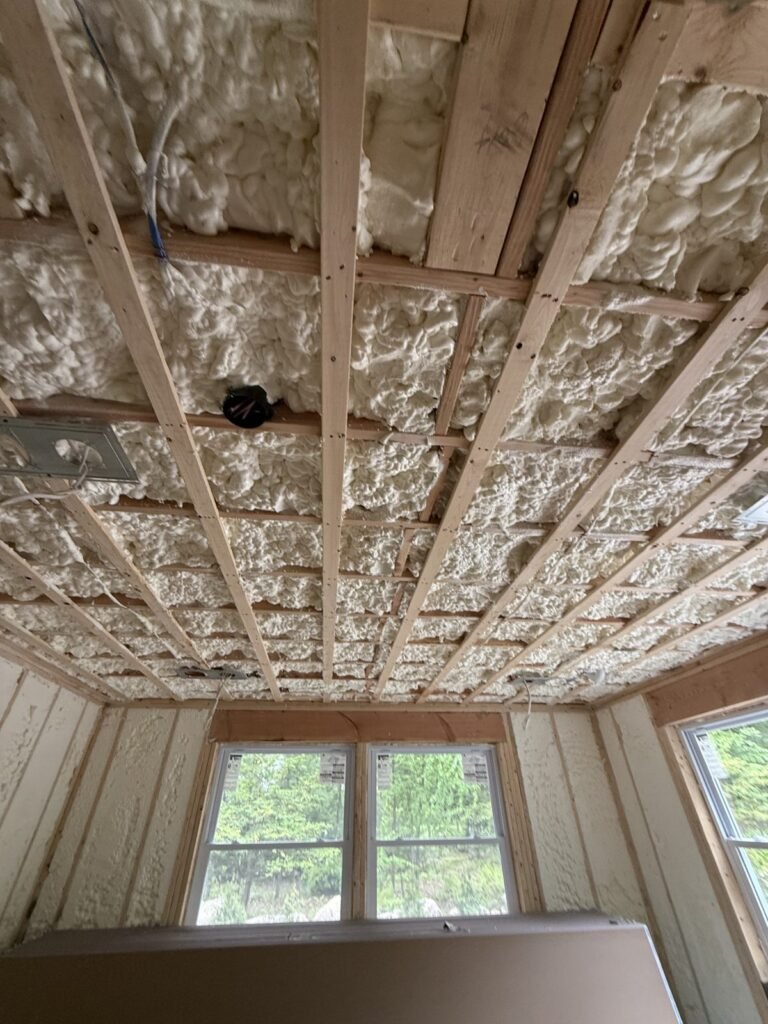 Spray-foamed ceiling above strapping facing a triple window - HERS rating in Milford, MA