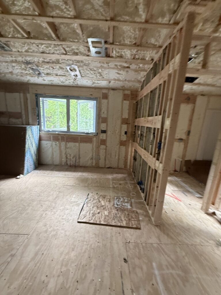 Bedroom with spray-foamed walls and ceiling ready for drywall - HERS rating in New Bedford, MA