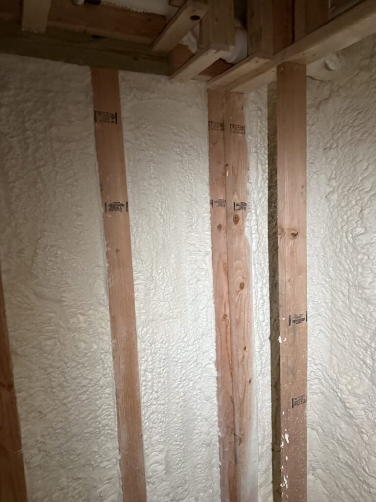 Spray foam on basement walls between studs - spray foam insulation in Wrentham, MA
