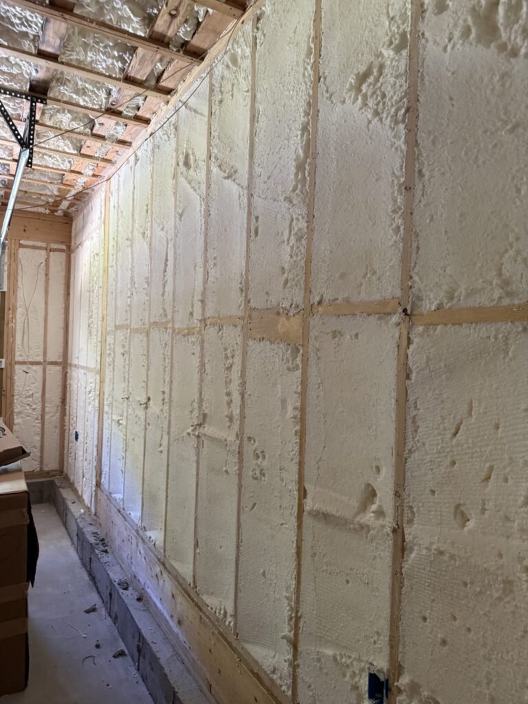 Spray foam on a long exterior wall in a garage space - spray foam insulation in Hingham, MA