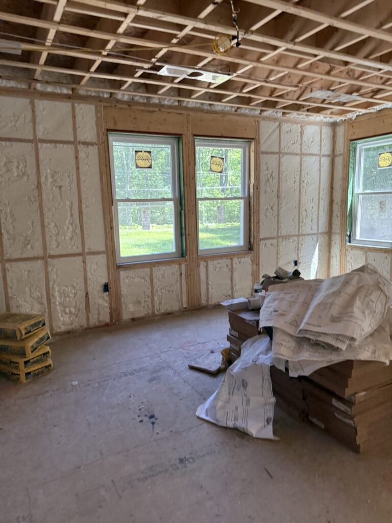 Spray-foamed living room walls around three windows - spray foam insulation in Barnstable, MA