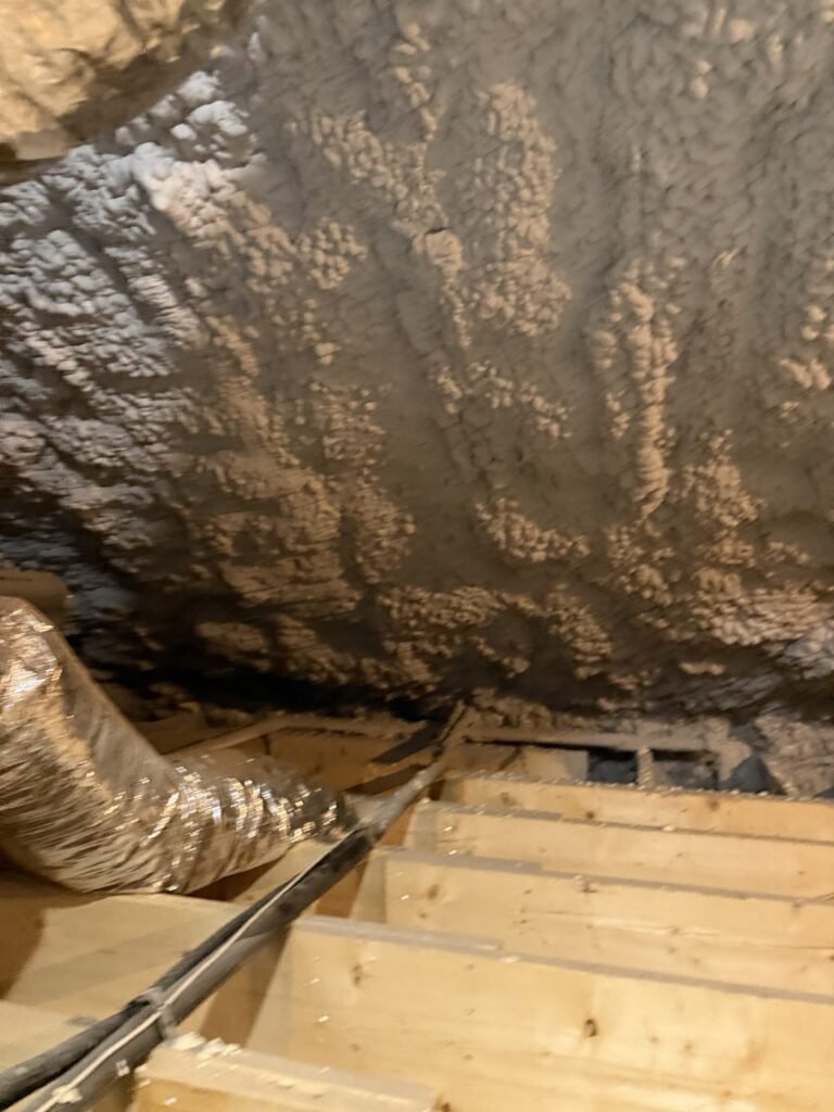 Spray foam on an unvented attic roof deck above insulated ductwork - HERS rating in Middlefield, MA