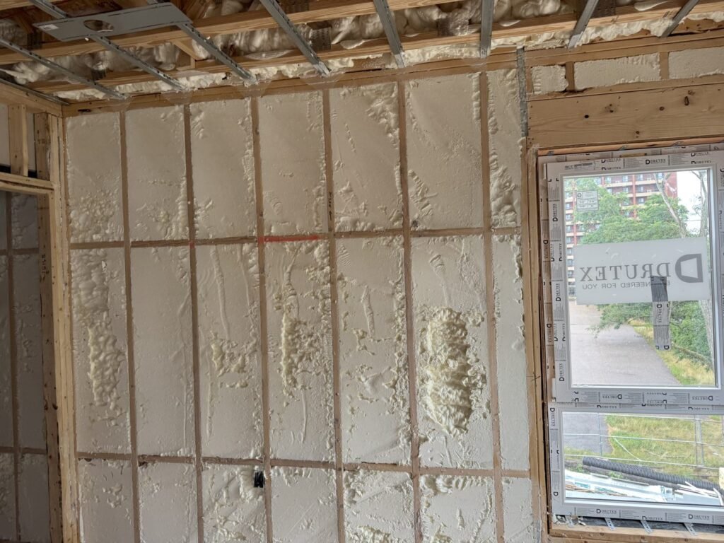 Spray-foamed wall next to a large window during a remodel - HERS rating in Pittsfield, MA