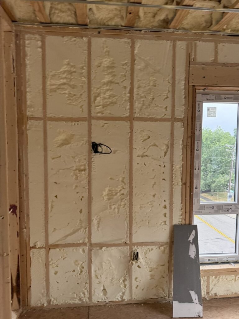 Spray foam wall beside a large window - spray foam insulation in Hatfield, MA