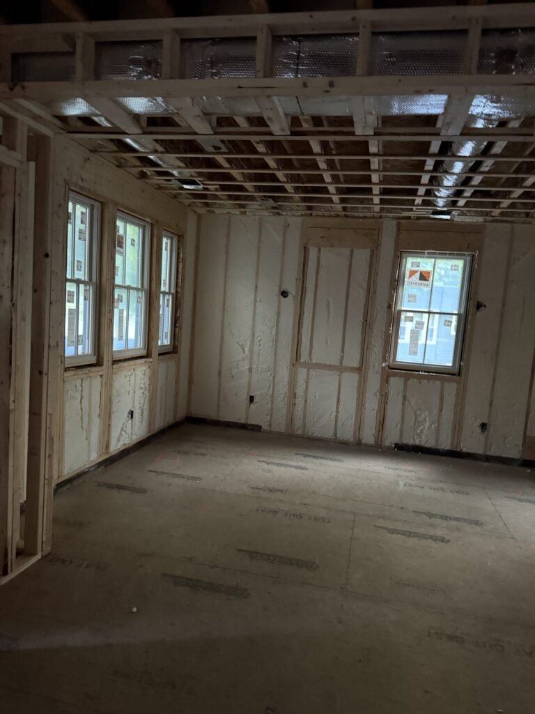 Spray foam walls around a row of windows in a large room - spray foam insulation in Florida, MA