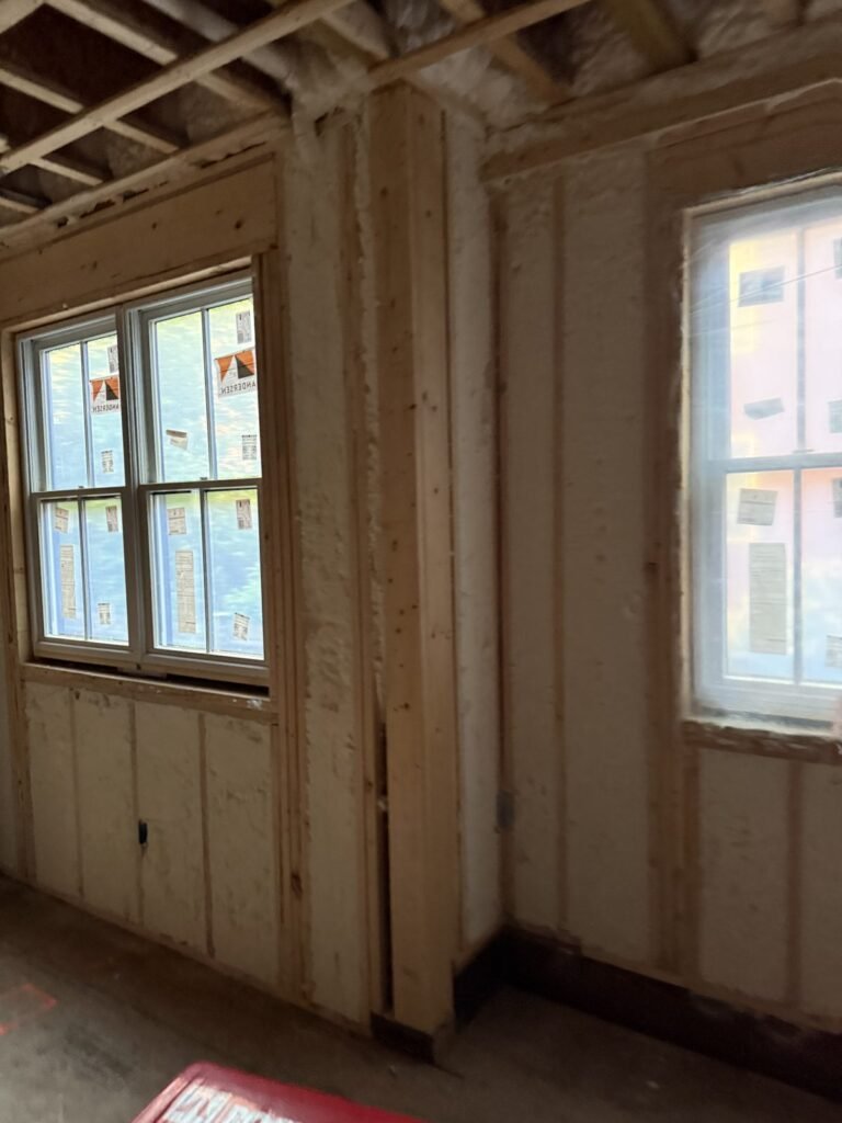 Spray foam walls around two windows in a corner - spray foam insulation in Tyringham, MA