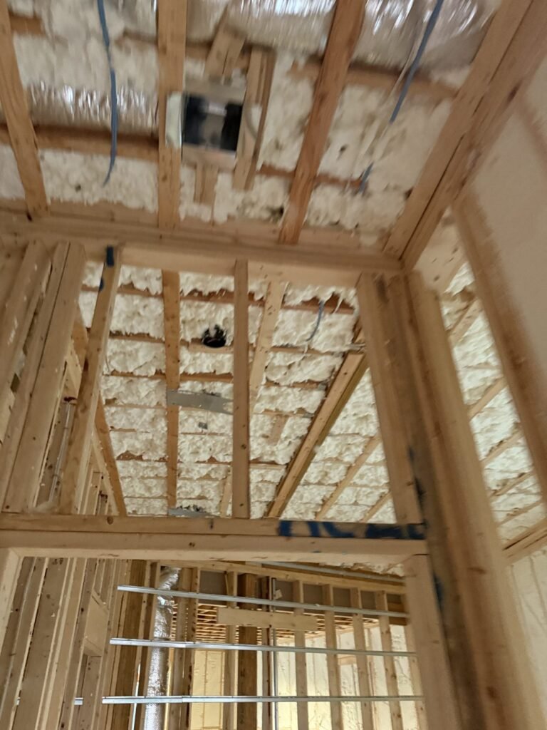Spray-foamed ceiling above new interior partition framing - HERS rating in Braintree, MA