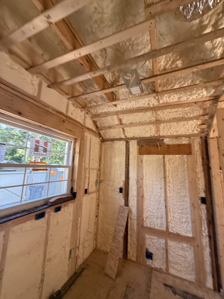Foamed narrow room with a window and ceiling strapping - HERS rating in Carver, MA