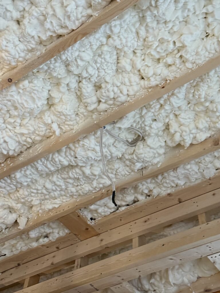 Close-up of spray foam ceiling bays with wiring - spray foam insulation in Lynn, MA