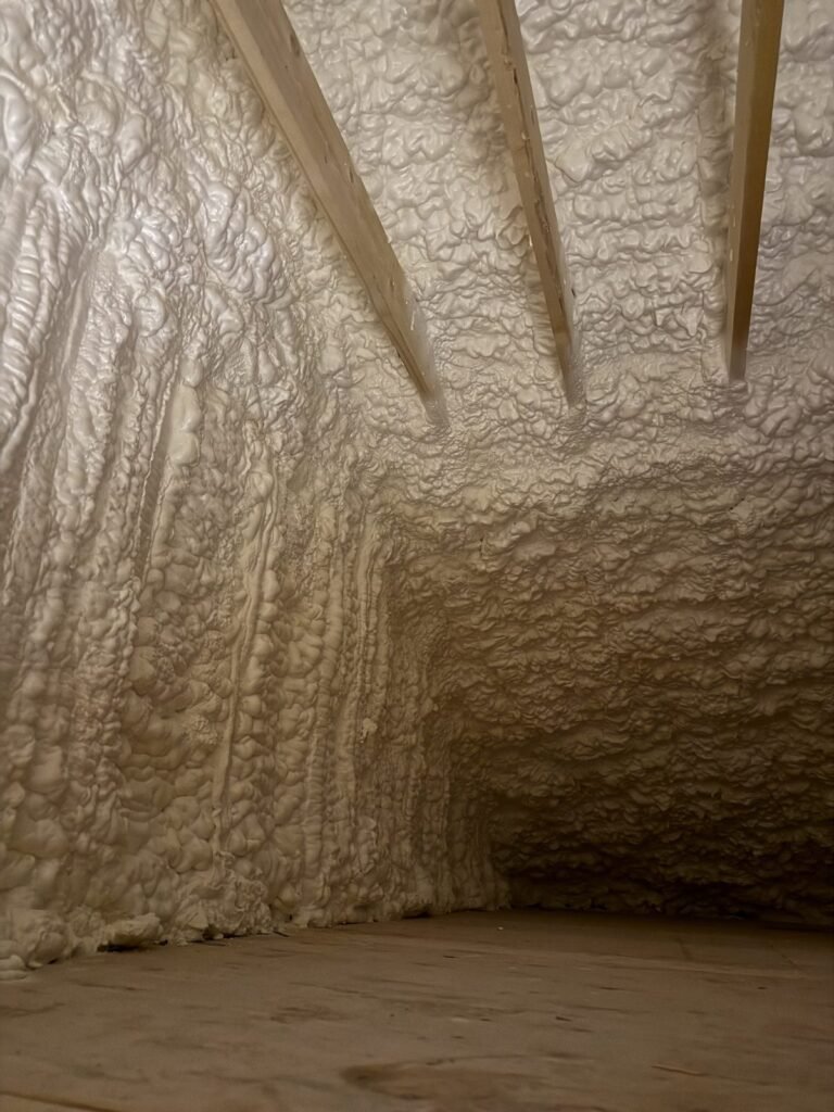 Thick spray foam covering a wall and sloped ceiling - HERS rating in Northborough, MA