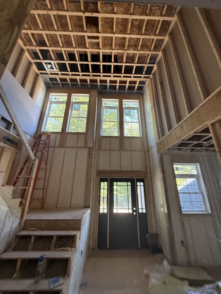 Two-story entry with spray-foamed walls above the front door and stairs - HERS rating in Taunton, MA