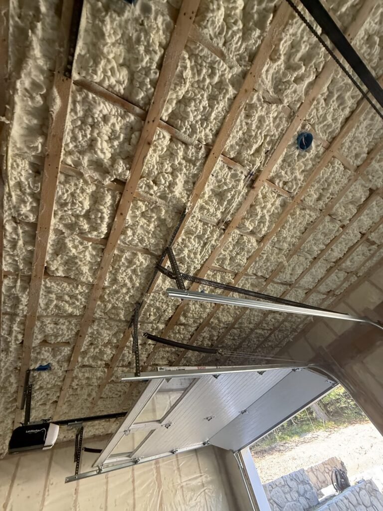 Foamed roof bays above a folding attic ladder - spray foam insulation in Monroe, MA